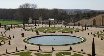 Explore the symmetrical garden designs of Versailles with picturesque views and rich history.