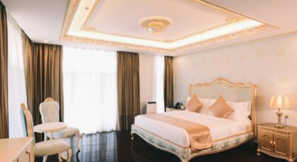 Elegant hotel room with luxury furnishings and soft lighting, perfect for relaxation.