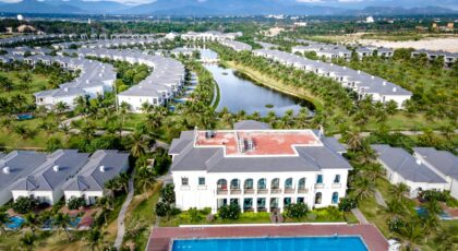Stunning aerial shot of a resort with villas, pool, and lush greenery in Vietnam.