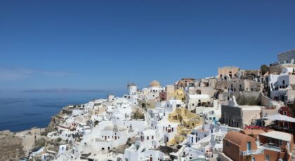 Stunning view of Santorini's white buildings against the Aegean Sea in Oia, Greece.