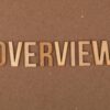 High-resolution image of wooden letters spelling 'OVERVIEW' on a brown background.